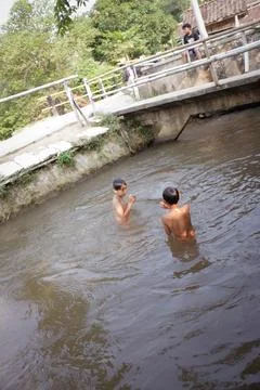 Children Caught Cold While Bathing in The River Stock Photos