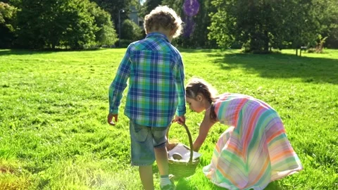 Children celebrating Easter outdoors in nature Stock Footage 301593790