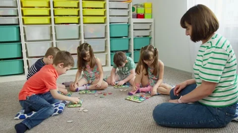 Children chat with the teacher in the classroom. Stock Footage 245750143