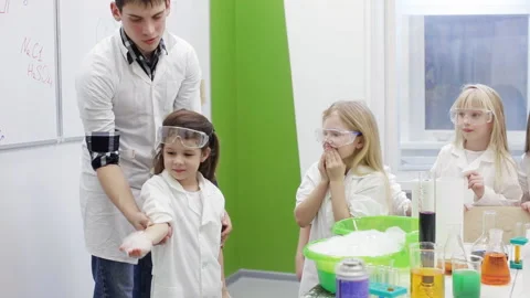 Children in the chemistry class make an experiment with fire Stock Footage 86678460