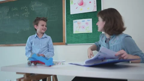 Children with classroom presentation activities in front of the classroom Stock Footage 282878364