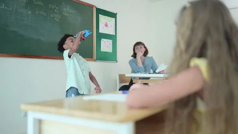 Children with classroom presentation activities in front of the classroom Stock Footage 283009799