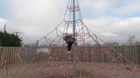 Children climbing and having fun at a playground designed for kids. Vidéo 238560153