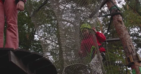 Children climbing in a park 스톡 동영상 222916223