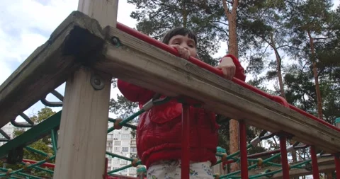 Children climbing in a park 스톡 동영상 222918327