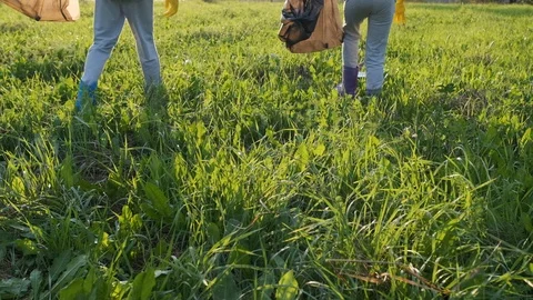 Children collect garbage in a bag. Stock Footage 120732155