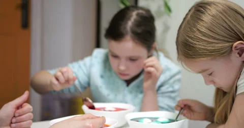 Children Coloring Eggs During Easter Activity, Focused on Bright Colors Video stock 300411175