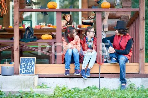 Children communicating during Halloween party Stock Photos
