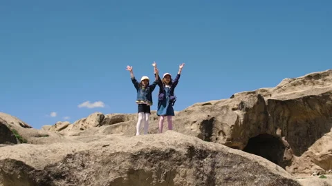Children conquered the mountain, at the top. Selective focus. Stock Footage 196949535