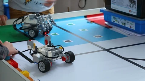 Children construct and program robots. E... | Stock Video | Pond5