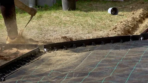 Children constructing a path, in the sensory garden, made  of diferent materials Video stock 139742757