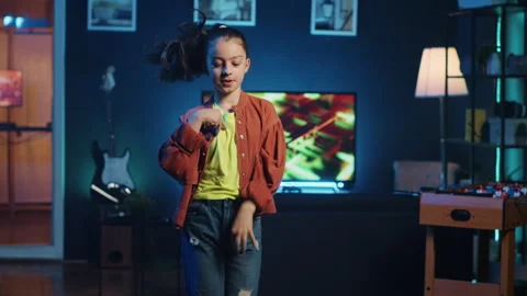 Children content creator filming dancing video for online streaming platforms Stock Footage 255621672