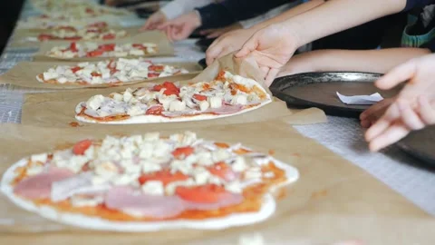 Children cook pizza. Master class from the chef in a restaurant, Close-up of Stock Footage 132028646