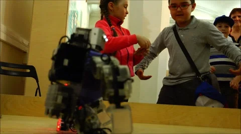 Children copy dancing robots. Slow motion. New technologies. Stock Footage 52363092