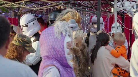 Children in costume queue at a decorated house on Capitol Hill at Halloween Stock Footage 345299583