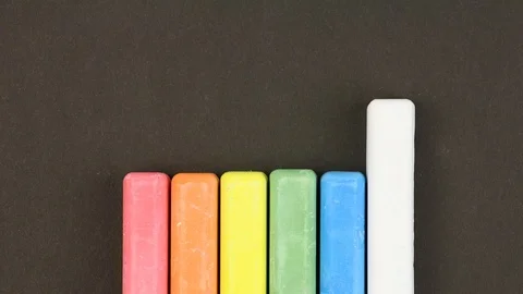 Children crayons on black background, come out  randomly, closeup, animation 動画素材 106553152