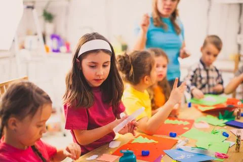 The children create a beautiful application together Stock Photos