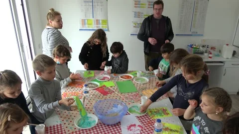 Children create in class doing application work with painted grains 2 스톡 동영상 147741055