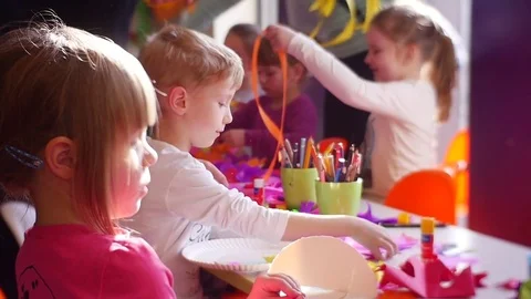 Children Create a Multi-Coloured Decorations Stock Footage 72437688