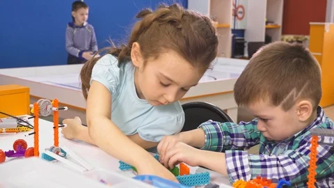 Children creating robots at school, stem education. Early development, diy Stock Footage 90711929
