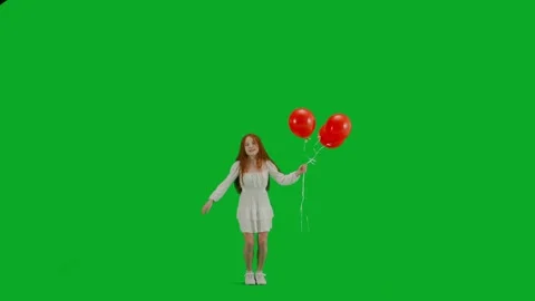 Children creative concept. Redheaded little girl in white dress with three red 스톡 동영상 259828181