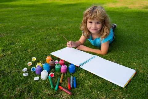 Children creative, developing imagination, creativity. Child boy drawing in Stock Photos