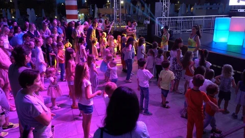 Children dance in front of the stage. Mini disco. Stock Footage 92346664