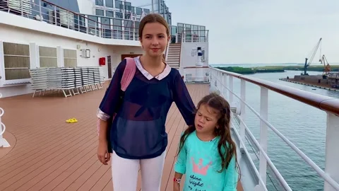 Children on the deck of a large ship during a sea cruise. Stock Footage 253428836