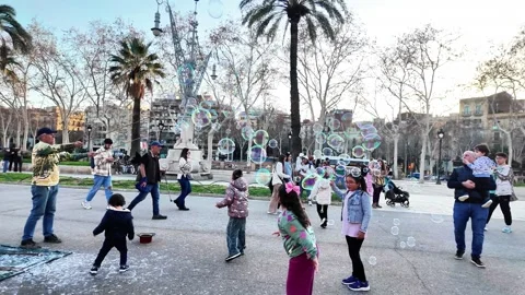 Children of different races playing with soap bubbles in the park, 4K Stock Footage 265620275