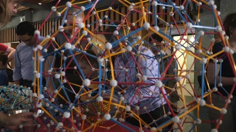 Children discovering geometric principles at a science fair. Stock Footage 50032939