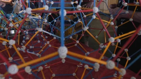 Children discovering geometric principles at a science fair. Stock Footage 50033066