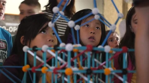 Children discovering geometric principles at a science fair. Stock Footage 50033377