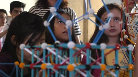 Children discovering geometric principles at a science fair. Stock Footage 50033481