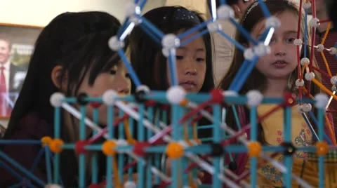 Children discovering geometric principles at a science fair. Stock Footage 50033565
