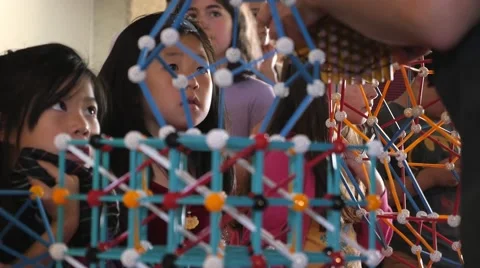 Children discovering geometric principles at a science fair. Stock Footage 50033640