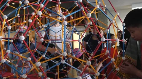 Children discovering geometric principles at a science fair. Stock Footage 50033726