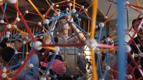 Children discovering geometric principles at a science fair. Stock Footage 50033869