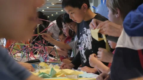 Children discovering mathematical principles at a science fair. Stock Footage 50032086