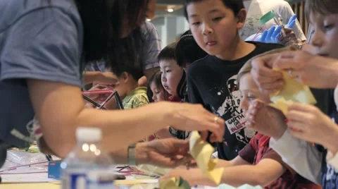 Children discovering mathematical principles at a science fair. Stock Footage 50032119