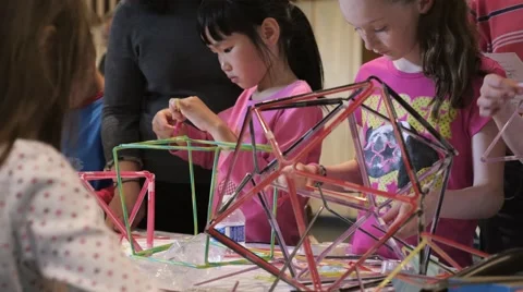 Children discovering mathematical principles at a science fair. Stock Footage 50032212