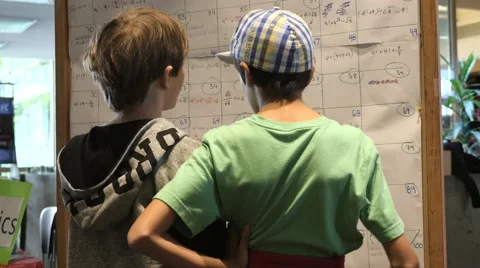 Children discovering mathematical principles at a science fair. Stock Footage 50032410