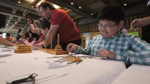 Children discovering mathematical principles at a science fair. Stock Footage 50032660