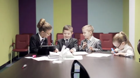 Children discussing  project in office Stock Footage 61245755