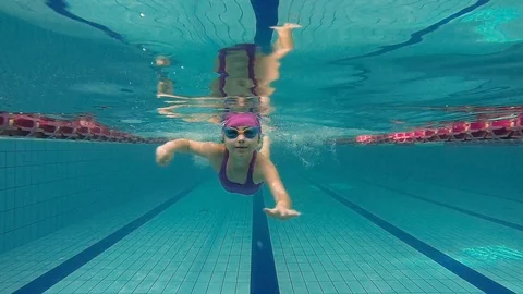 Children dive in to the pool Stock Footage 106307063