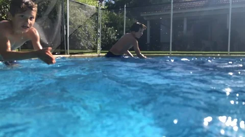 Children diving underwater in super slow-motion 240fps Stock Footage