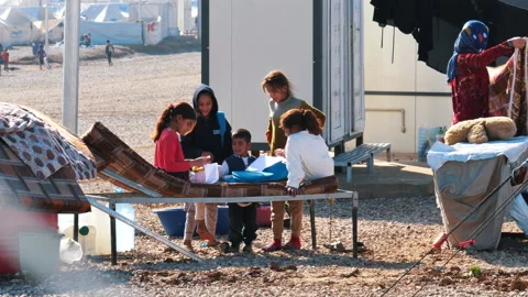 Children do their homework in a refugee camp. November 9, 2017, Mosul, Iraq. Stock Footage 158378195