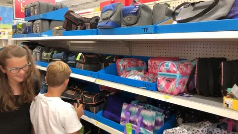 Children doing back to school shopping for school supplies Stock Footage 92925980