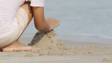 Children doing castles on the beach  Stock Footage 31819202