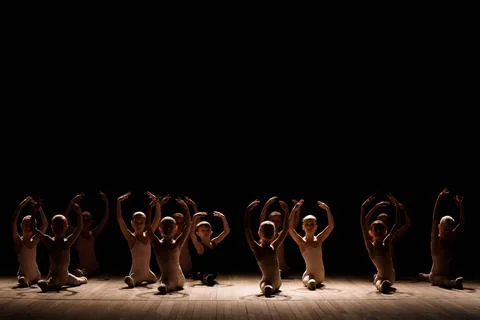 Children doing splits while warming up on the stage Fotos Stock