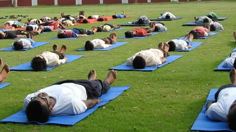 Children doing yoga in Yoga Classes Stock Footage 64580825
